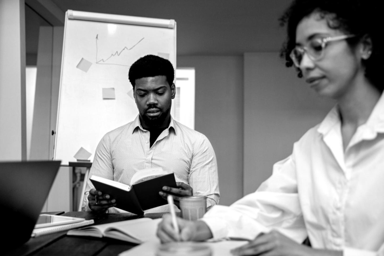 Business owner reviewing financial documents at desk